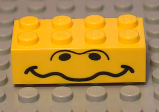 [P 3001px2 (Yellow)] Brick 2 x 4 with Black Nostrils and Wavy Mouth Pattern