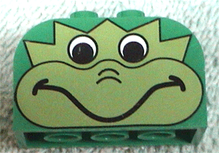 Slope, Curved 4 x 2 x 2 Double with 4 Studs with Dragon Head Pattern