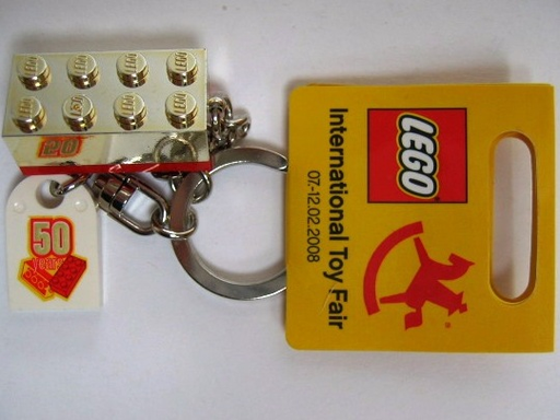 [G 852445a (No Colour)] 2 x 4 Brick - Chrome Gold Key Chain with Lego 50 Year Anniversary Logo Tile, Modified 3 x 2 Curved with Hole - International Toy Fair Promo