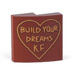 [P 15068pb194 (Reddish Brown)] Slope, Curved 2 x 2 x 2/3 with 'BUILD YOUR DREAMS K.F.' in Outlined Heart Pattern