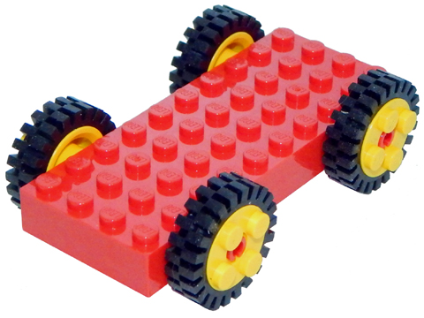 [P 30076c01 (Red)] Brick, Modified 4 x 10 with 4 Pins with 4 Yellow Wheel FreeStyle with Technic Pin Hole and 4 Black Tire 24mm D. x 8mm Offset Tread - Interior Ridges (30076 / 6248 / 3483)